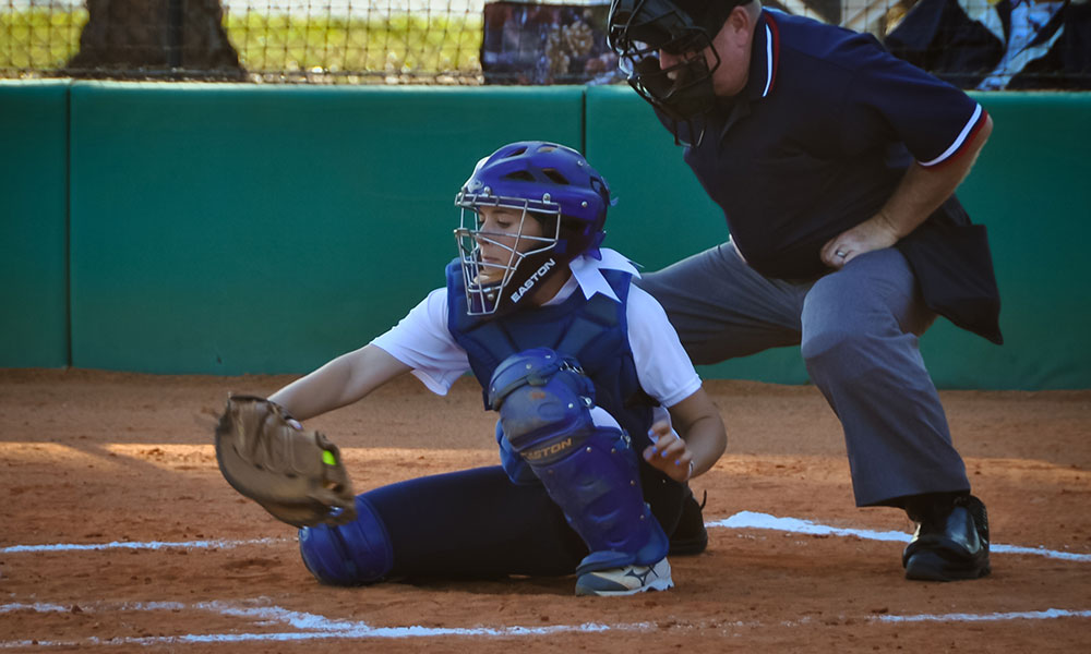 softball catchers in action